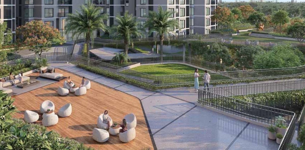 An open to sky seating area with lounge chairs and gardens, artist's impression