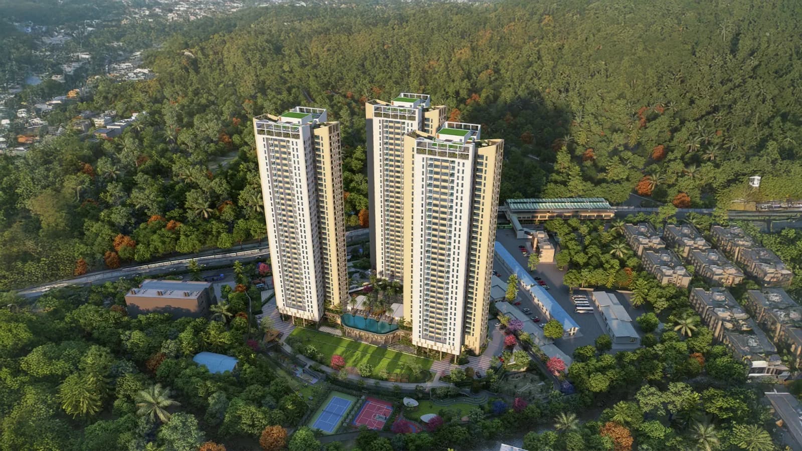 Sattva Aaranya, three towers rising out of the forest beside Mysore Road, seen from the air
