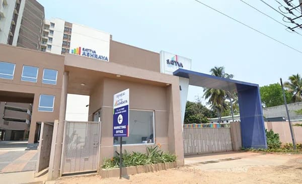 The entry gate and security lobby of Sattva Ashraya, site photo