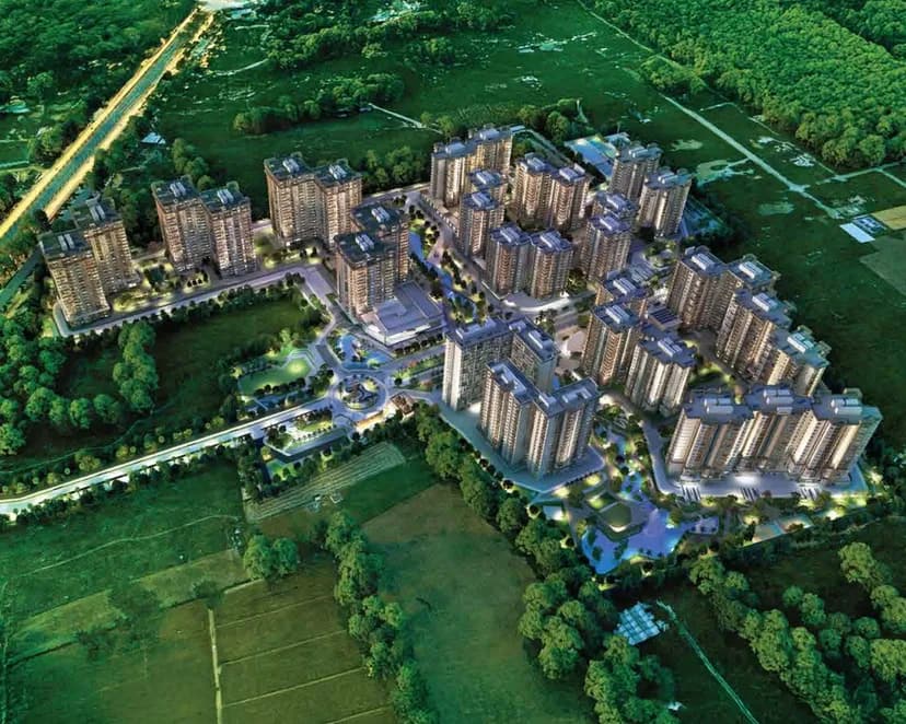 The Sattva City township from above, towers around central gardens beside the fields, artist's impression