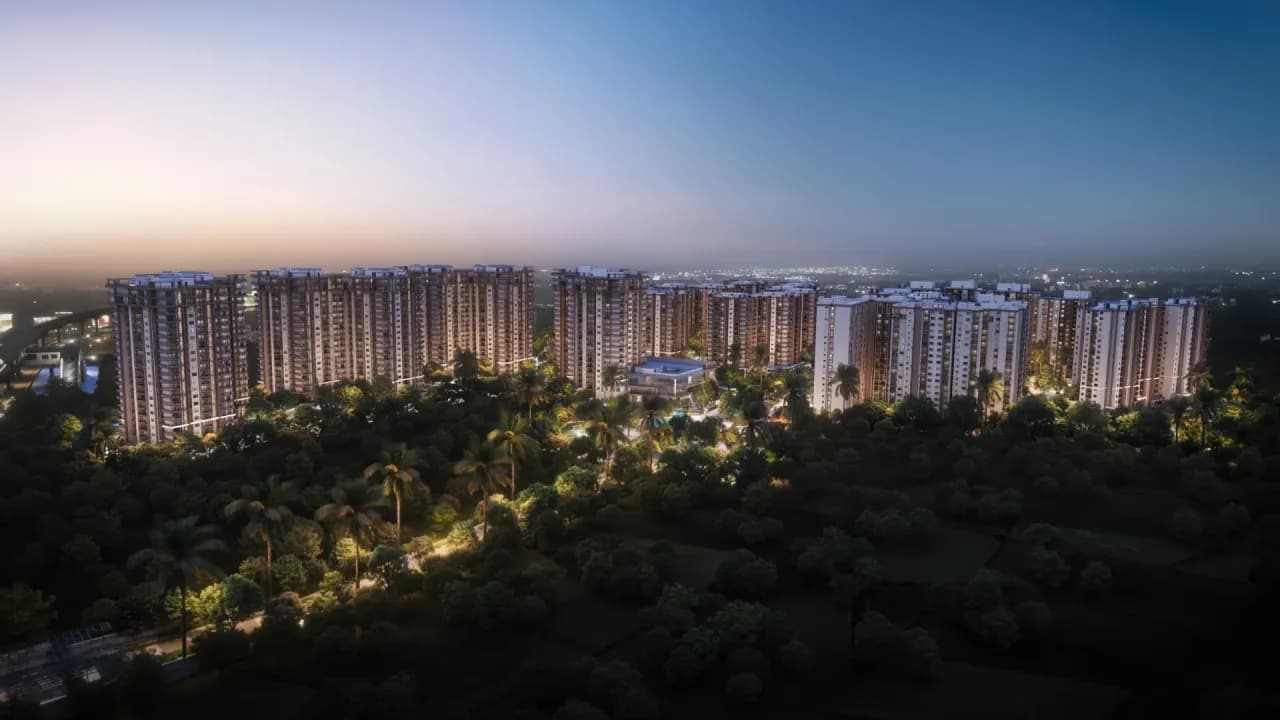 Sattva City towers at dusk above a tree canopy on Bengaluru Airport Road, artist's impression
