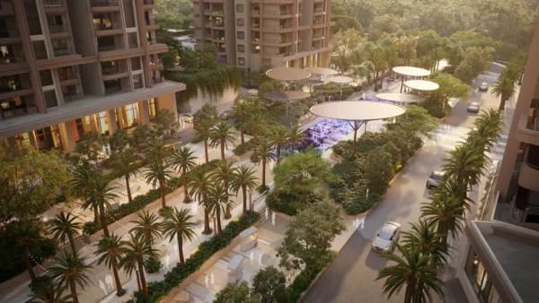 A palm lined walk with shade canopies between the Sattva City towers, artist's impression