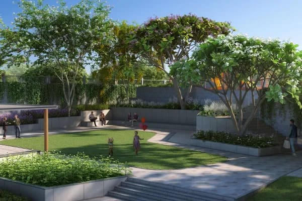 The amphitheatre and lawn at Sattva Forest Ridge, with flowering trees, artist's impression