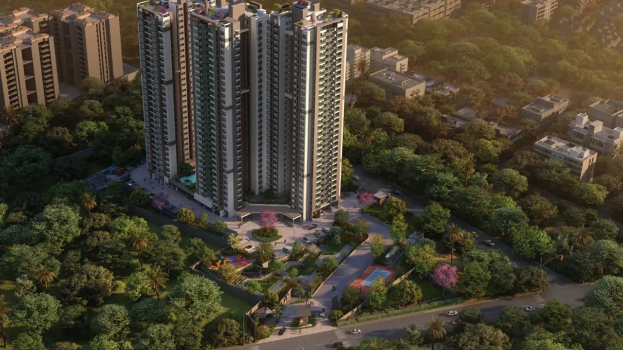 Aerial view of the Sattva Forest Ridge towers among the trees of JP Nagar 9th Phase at golden hour, artist's impression, the poster of the developer's walkthrough film
