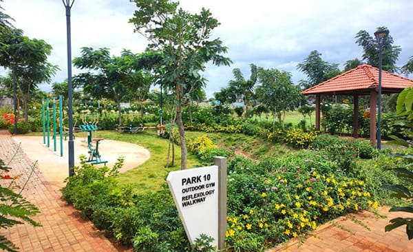 Park 10 with the outdoor gym and walkway at Sattva Green Groves, site photo, September 2026