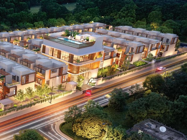 Sattva La Vita and its clubhouse at night, seen from above, artist's impression