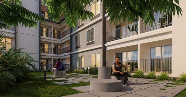 An apartment court with circular seating between the blocks at Sattva SimpliCity, artist's impression