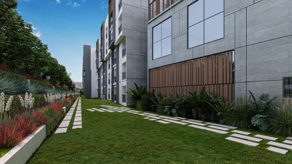 A landscaped walkway along a block at Sattva SimpliCity, artist's impression