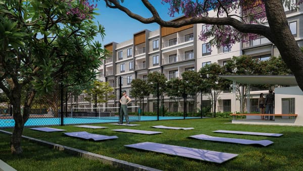 The yoga lawn with the blocks and the pool behind at Sattva SimpliCity, artist's impression