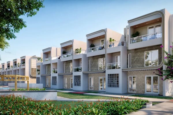 Sattva Songbird row houses beside a water feature and a lawn, artist's impression