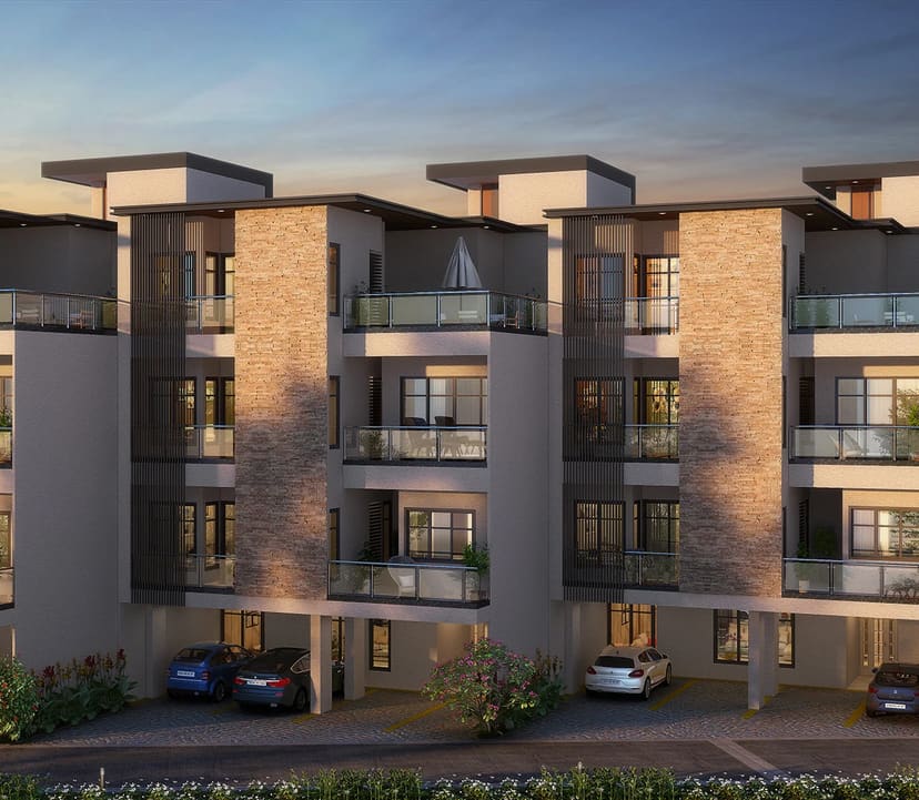 Sattva Springs row houses at dusk, with stone clad stair towers and glass balconies, artist's impression