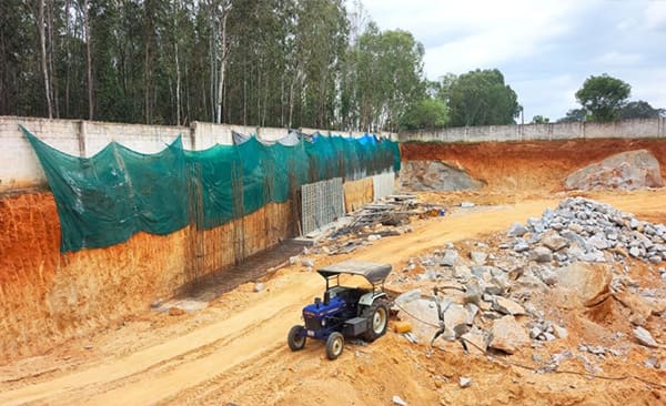 Sattva Vasanta Cove site in September 2026, the basement retaining wall, site photo